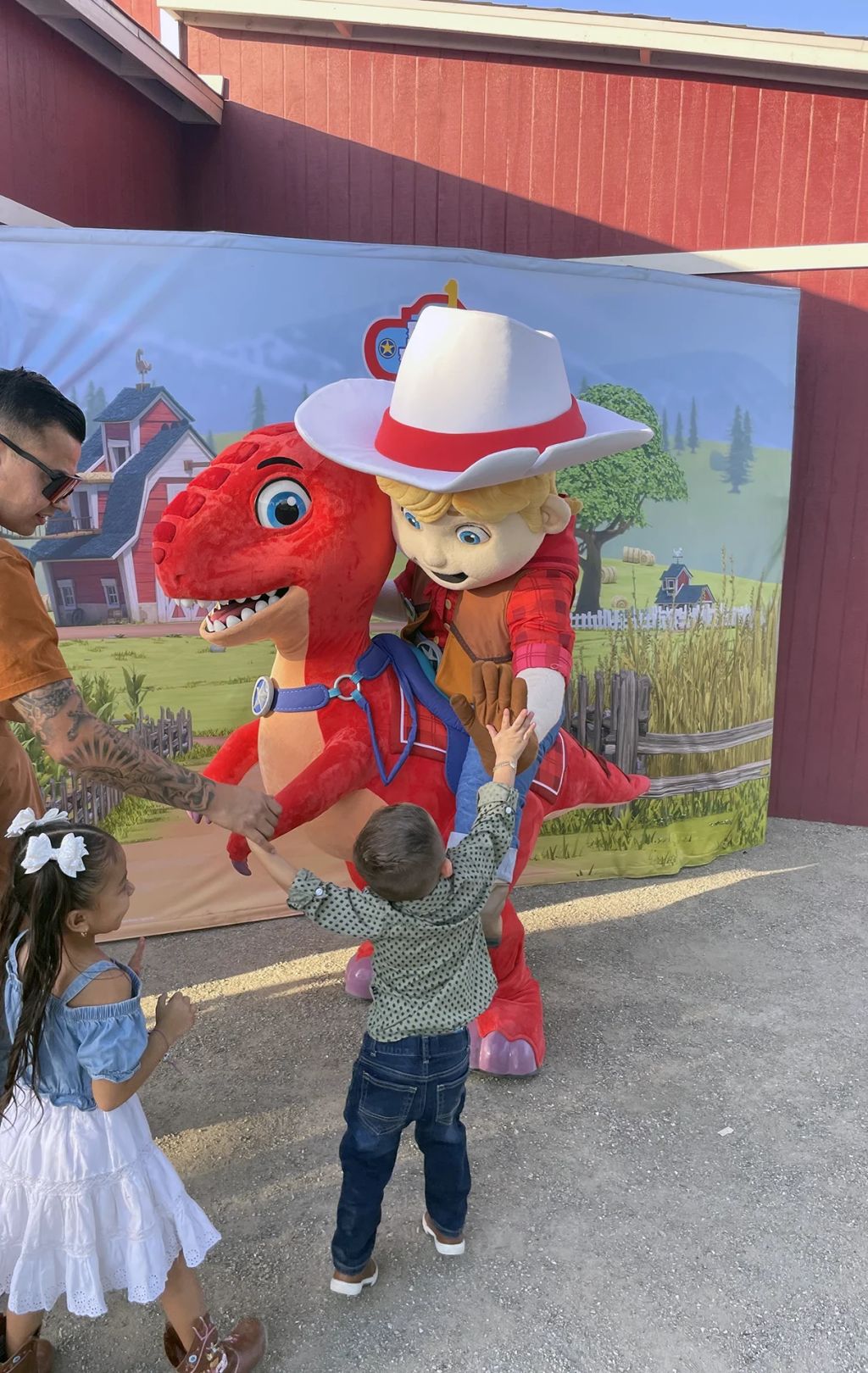 Cody and JJ from Dino Ranch pose with fans at a live meet and greet